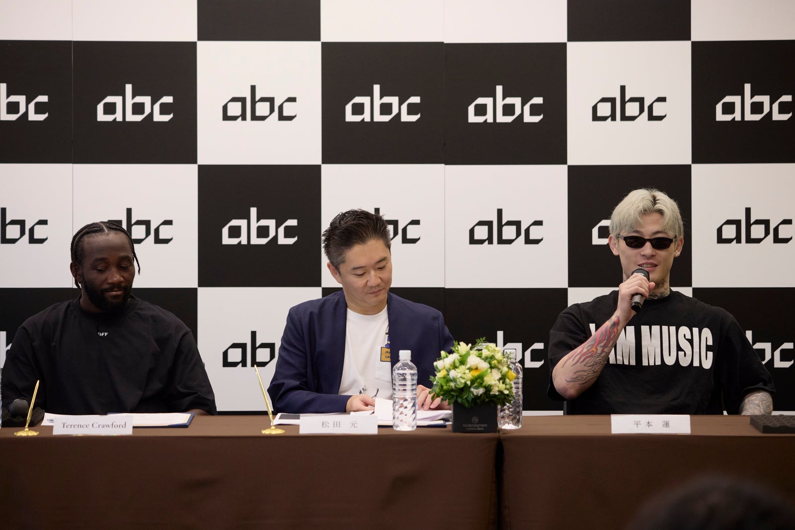 Terence Crawford, Gen Matsuda and RIZIN fighter Ren Hiramoto seated together at the Crawford Production Japan press conference in Tokyo