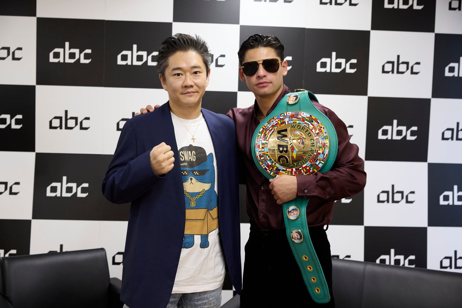 Gen Matsuda with professional boxer Ryan Garcia, who is holding a WBC world championship belt, at abc Inc.'s business announcement in Tokyo on 5 June 2026